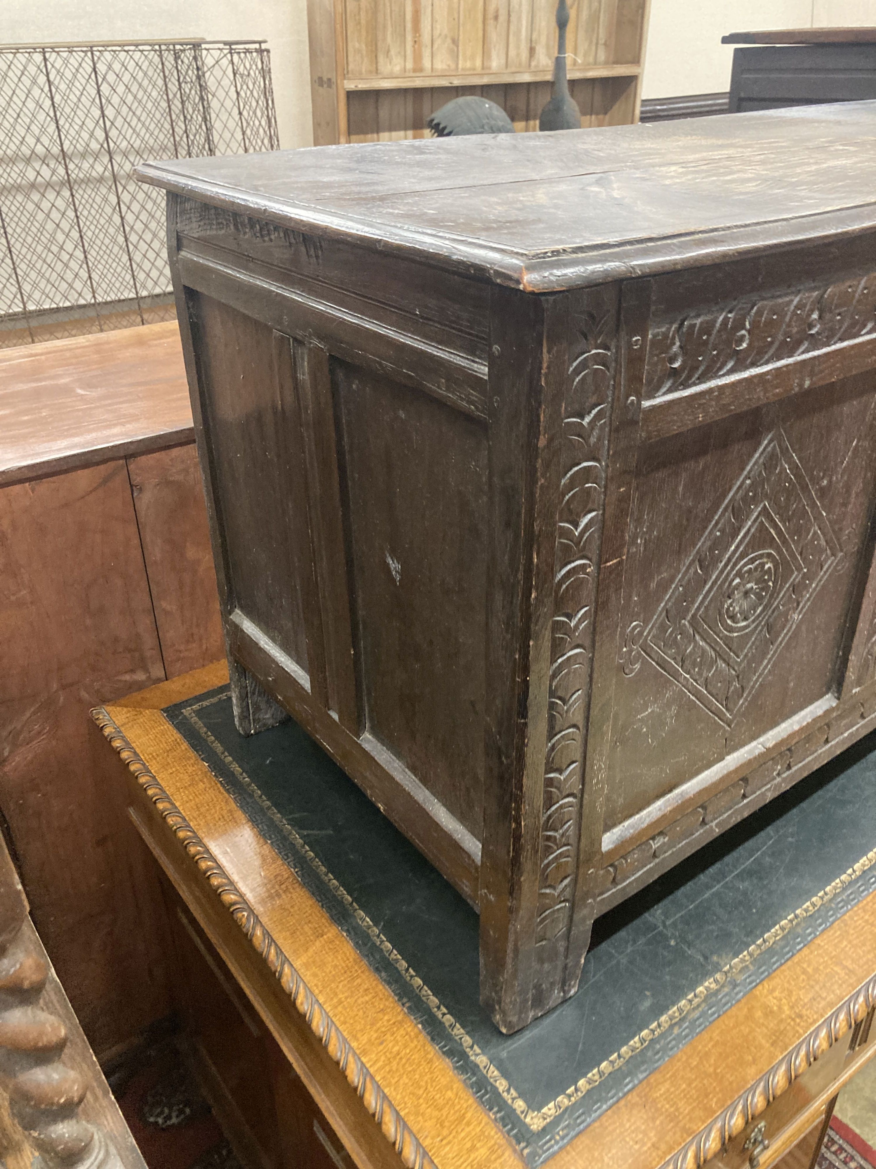 An early 18th century panelled oak coffer, length 134cm, depth 54cm, height 63cm